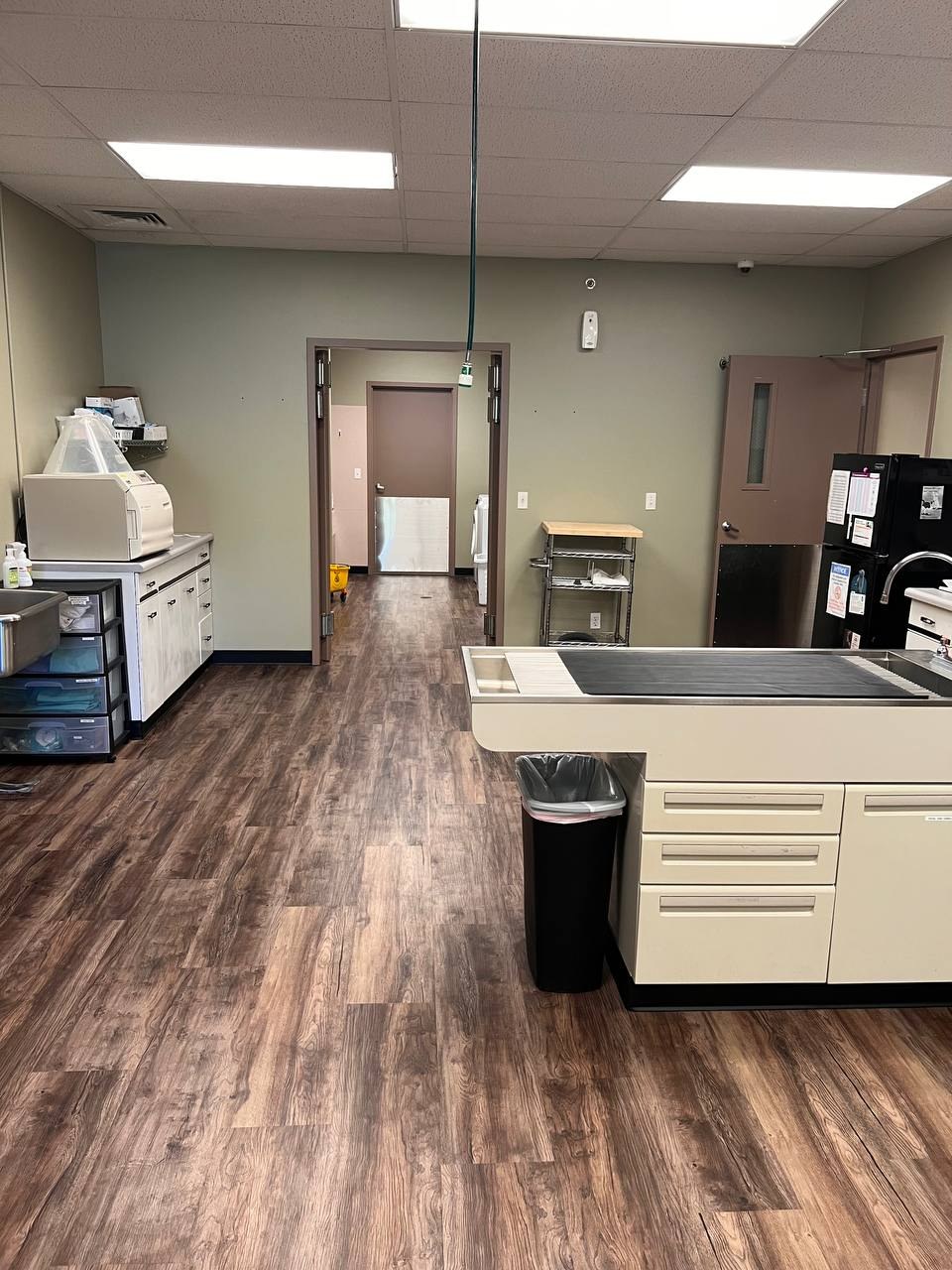 The treatment area with its wet table, autoclave, and supply shelving